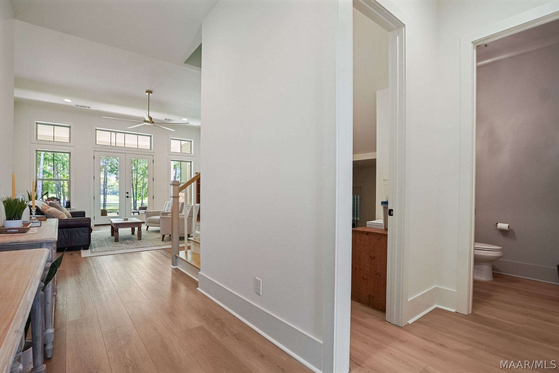 581 King's Meadow Street, Pike Road, AL 36064 In the foyer looking toward the great room pictured left and half bath and storage right.