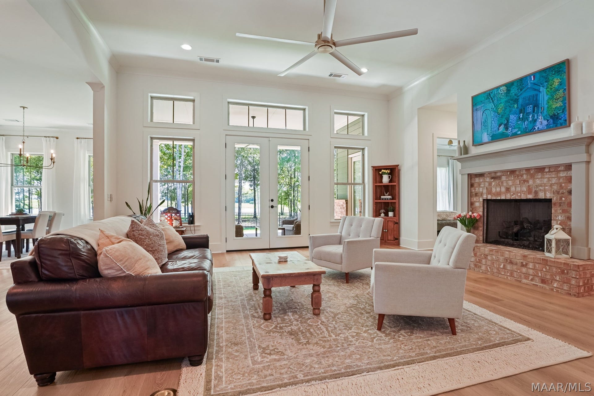 581 King's Meadow Street, Pike Road, AL 36064 Great room with gas log fireplace that opens onto the patio with water front view.