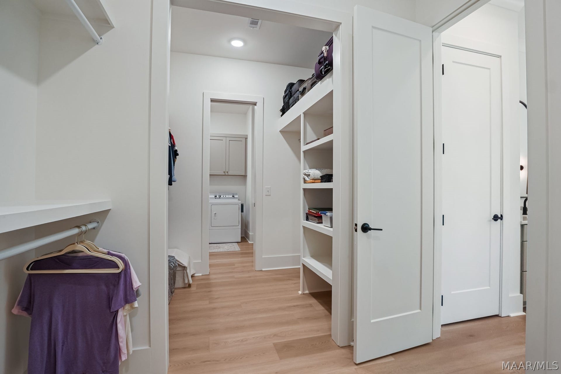 581 King's Meadow Street, Pike Road, AL 36064 Walk-in closet looking toward the laundry room