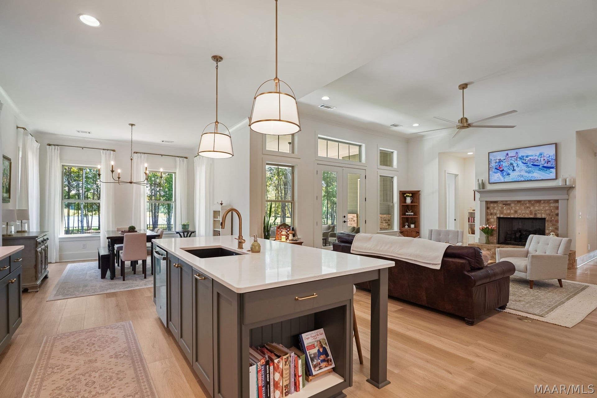 581 King's Meadow Street, Pike Road, AL 36064 Kitchen and dining room. There is a place for dog bowls at the end of the island where the cookbooks are.