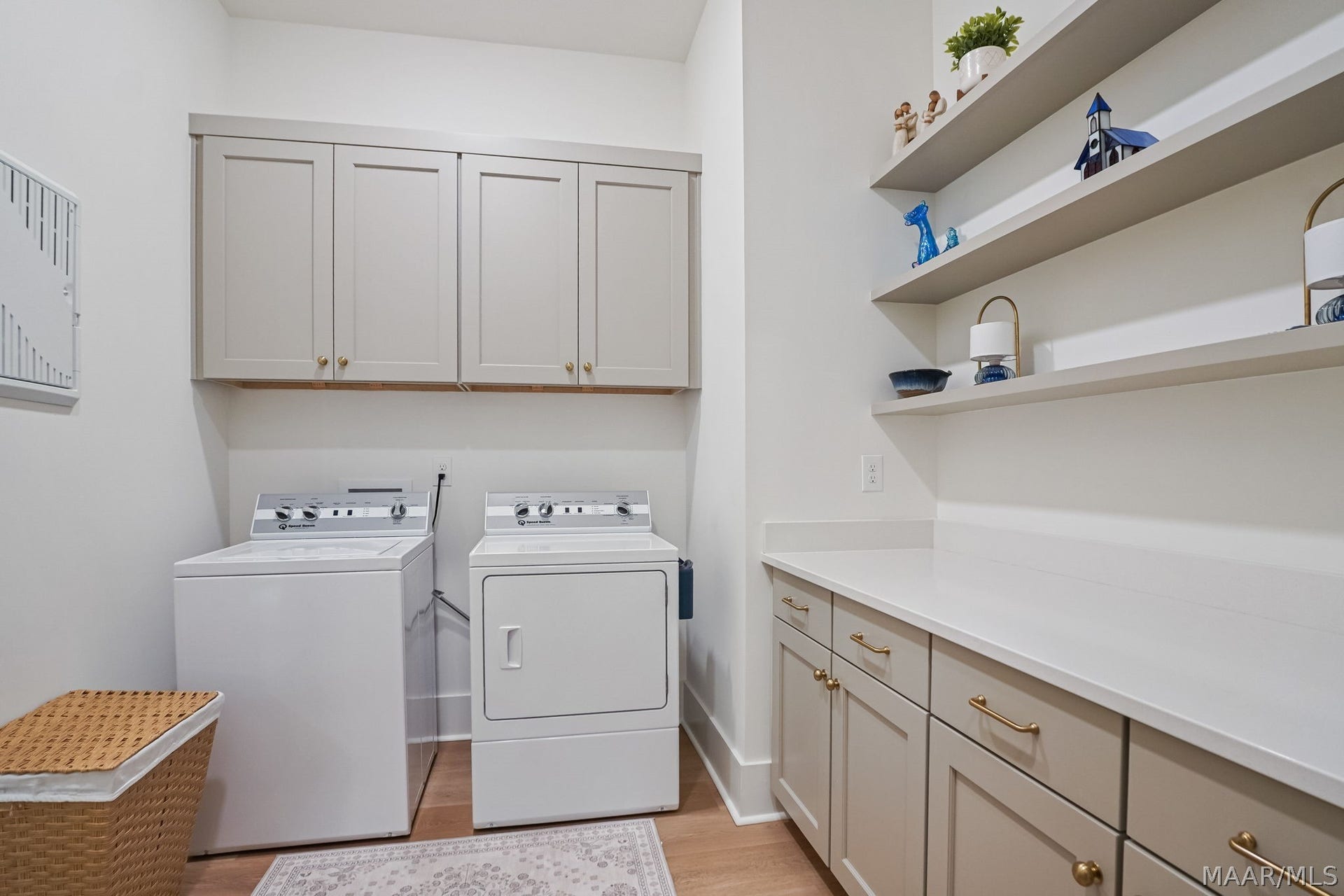 581 King's Meadow Street, Pike Road, AL 36064 The laundry room has two doors, one leading to the primary bedrooms walk-in closet, the other to hall across from the mudroom.