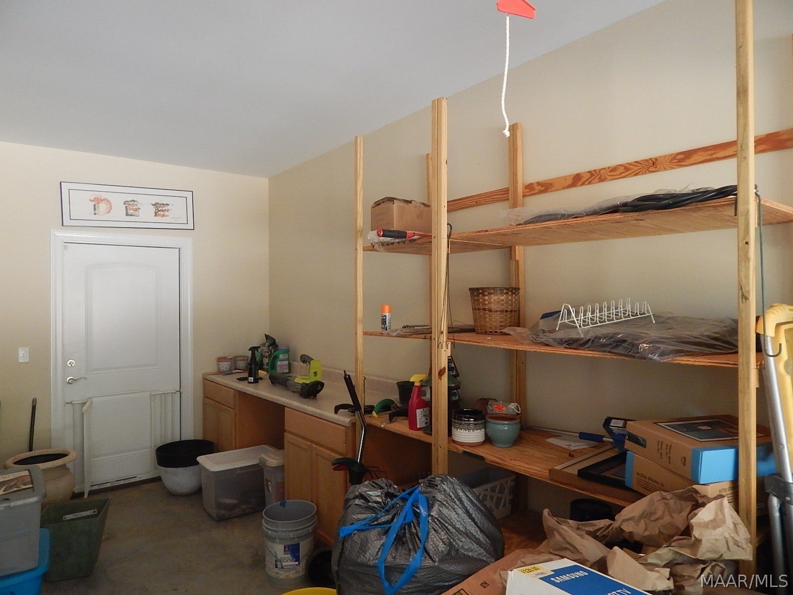 GARAGE HAS BUILT INS & SHELVES