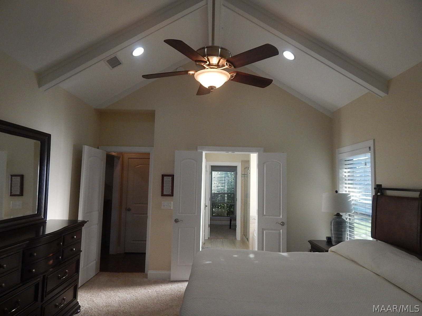 GORGEOUS PRIMARY SUITE HAS VAULTED CEILINGS TO 14'