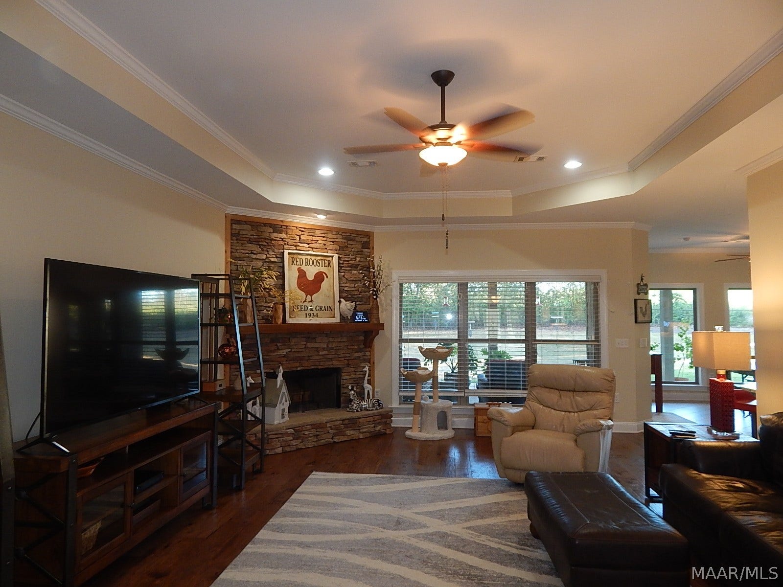 GORGEOUS LARGE FAMILY RM HAS BEAUTIFUL WOOD FLOORS-STACK STONE FIREPLACE & OCTAGONAL CEILING & OPEN TO KITCHEN