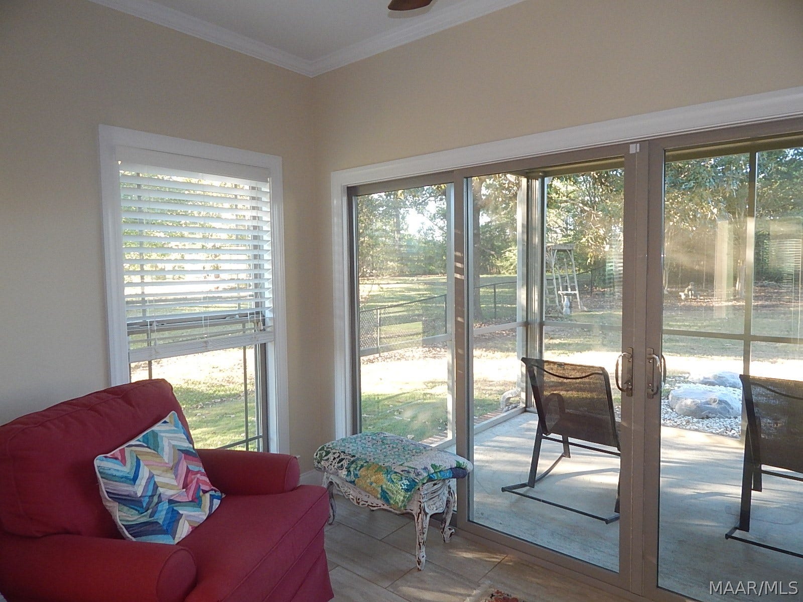 SITTING ROOM OR OFFICE OFF MASTER LOOKS OUT TO SCREENED PORCH