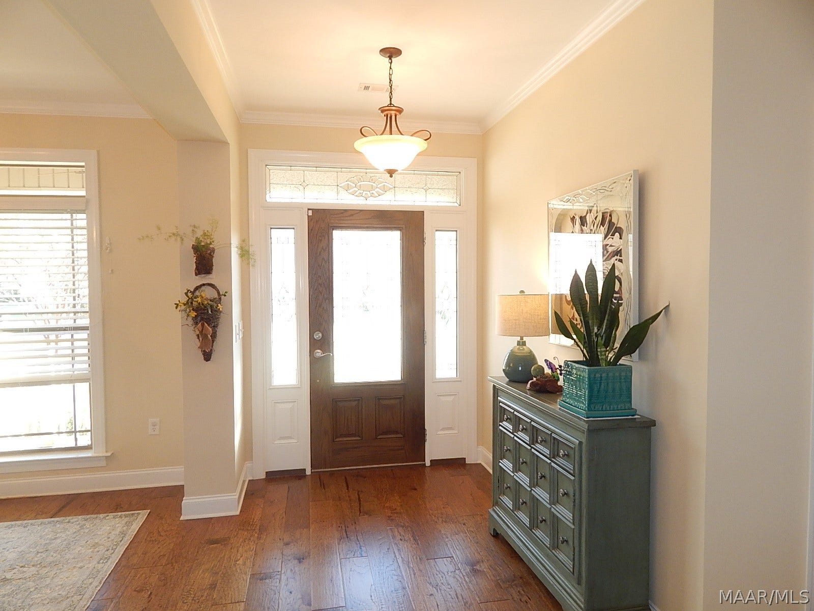 ENTRY FOYER HAS BEAUTIFUL WOOD FLOORS