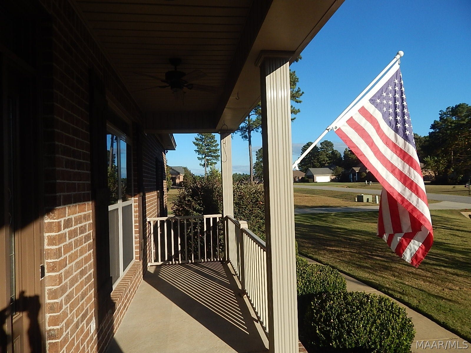 COVERED FRONT PORCH IS INVITING FOR ROCKERS