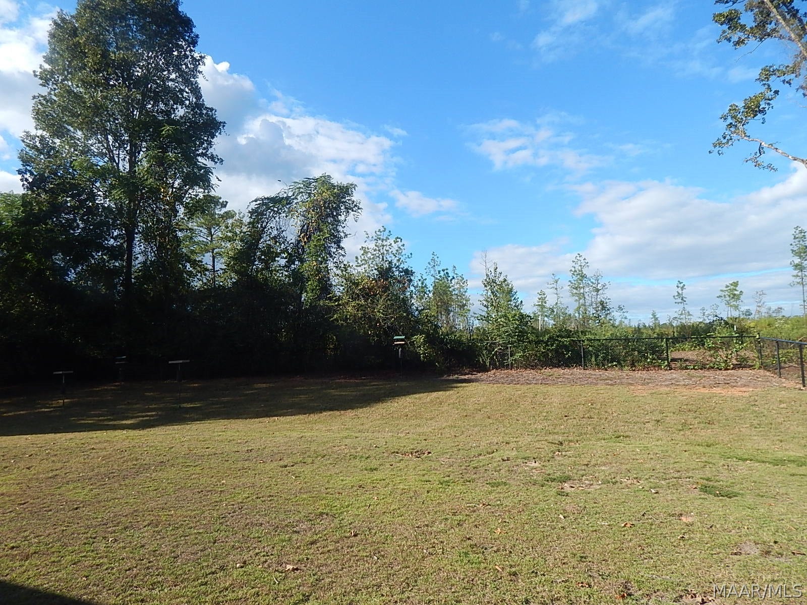 PRIVATE FENCED BKYARD W/WOODS BEHIND