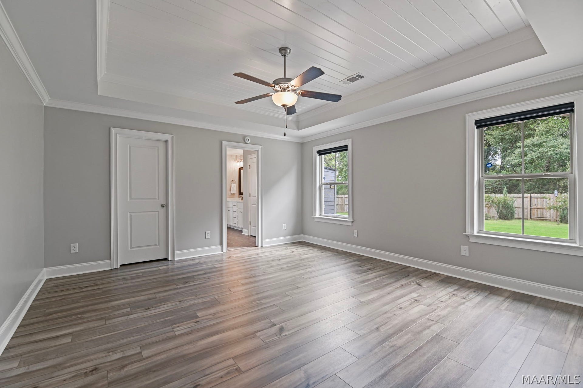 Primary bedroom with wood ceiling
