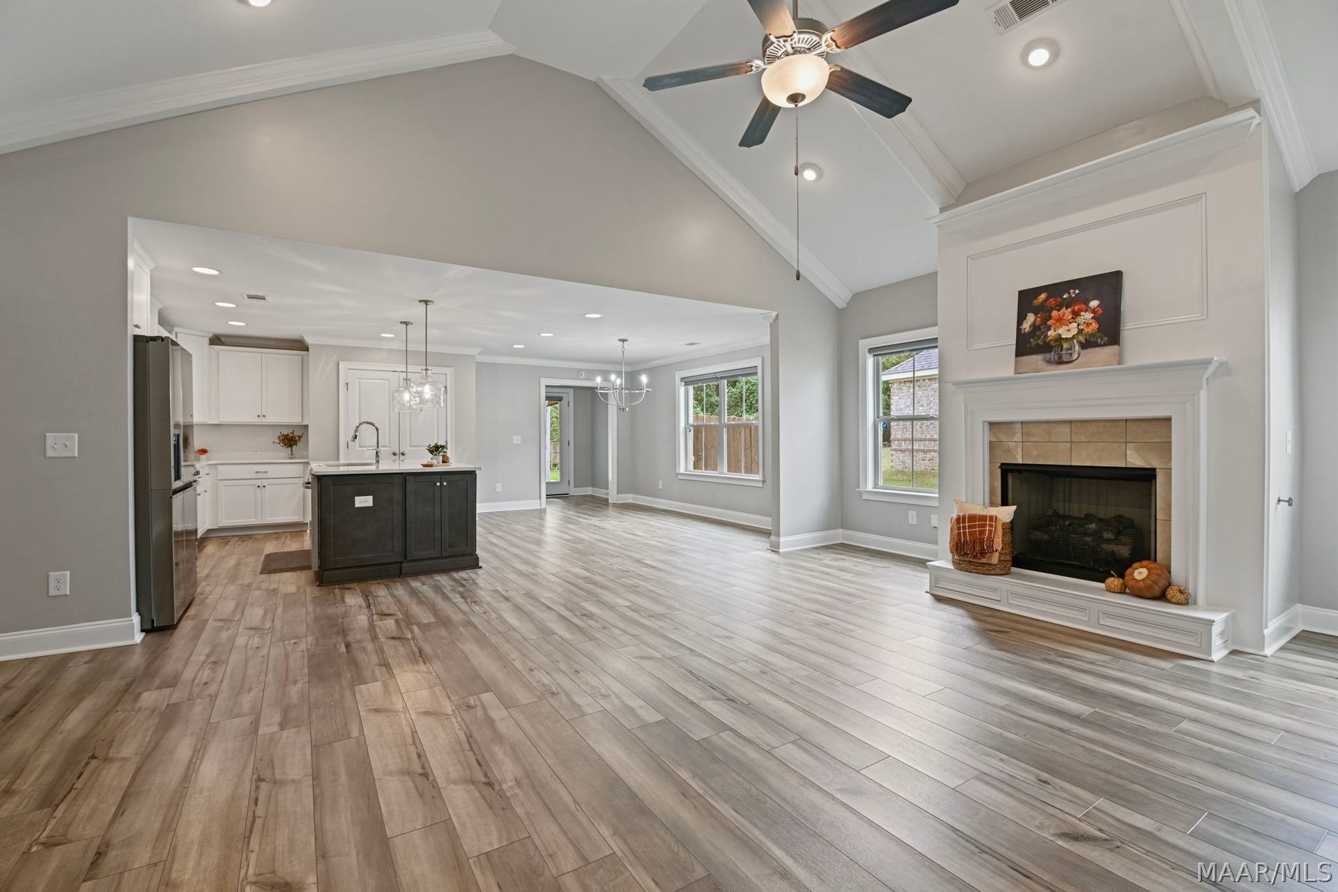 Great room with vaulted ceiling and open floor plan