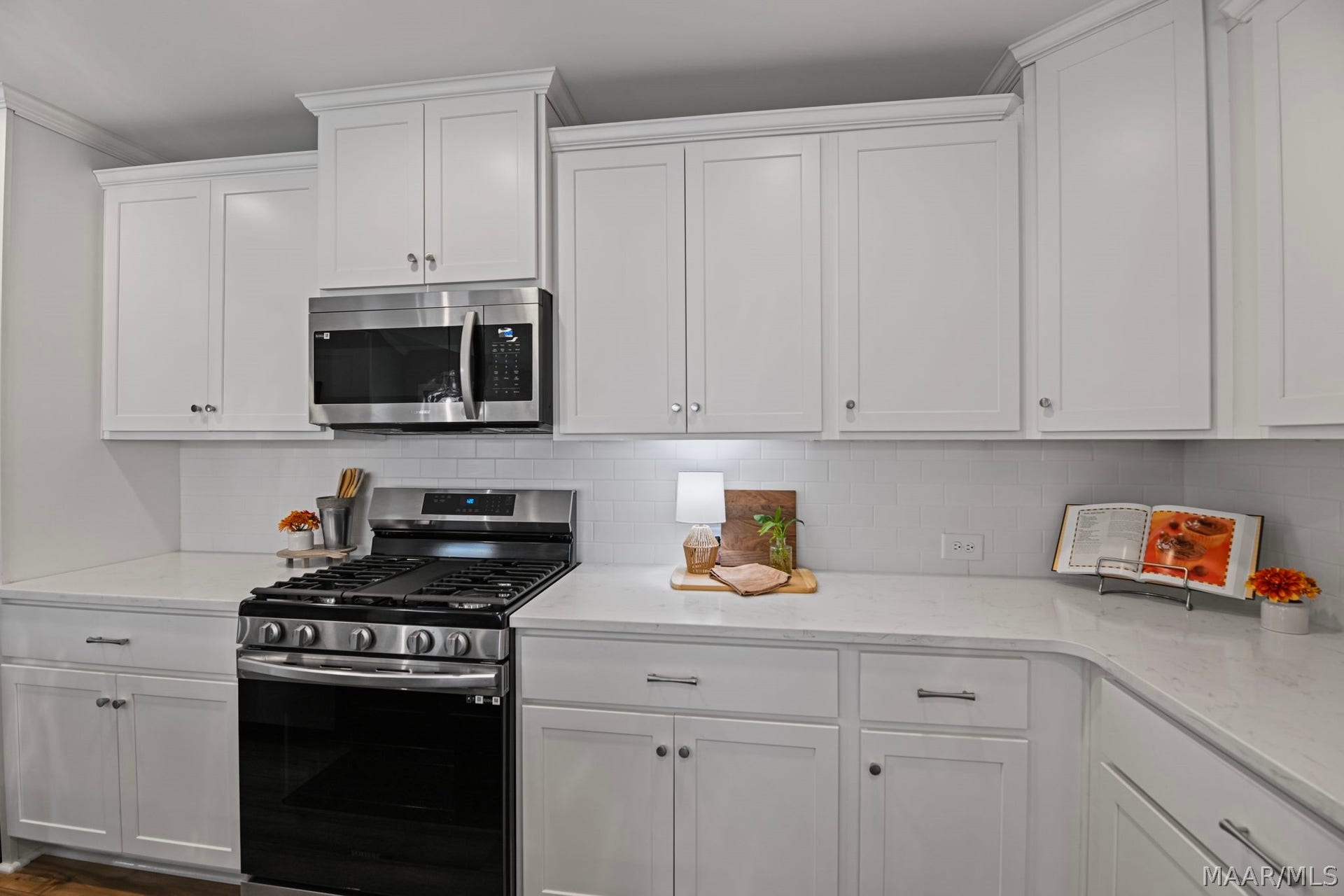 Quartz countertops and plenty of cabinets