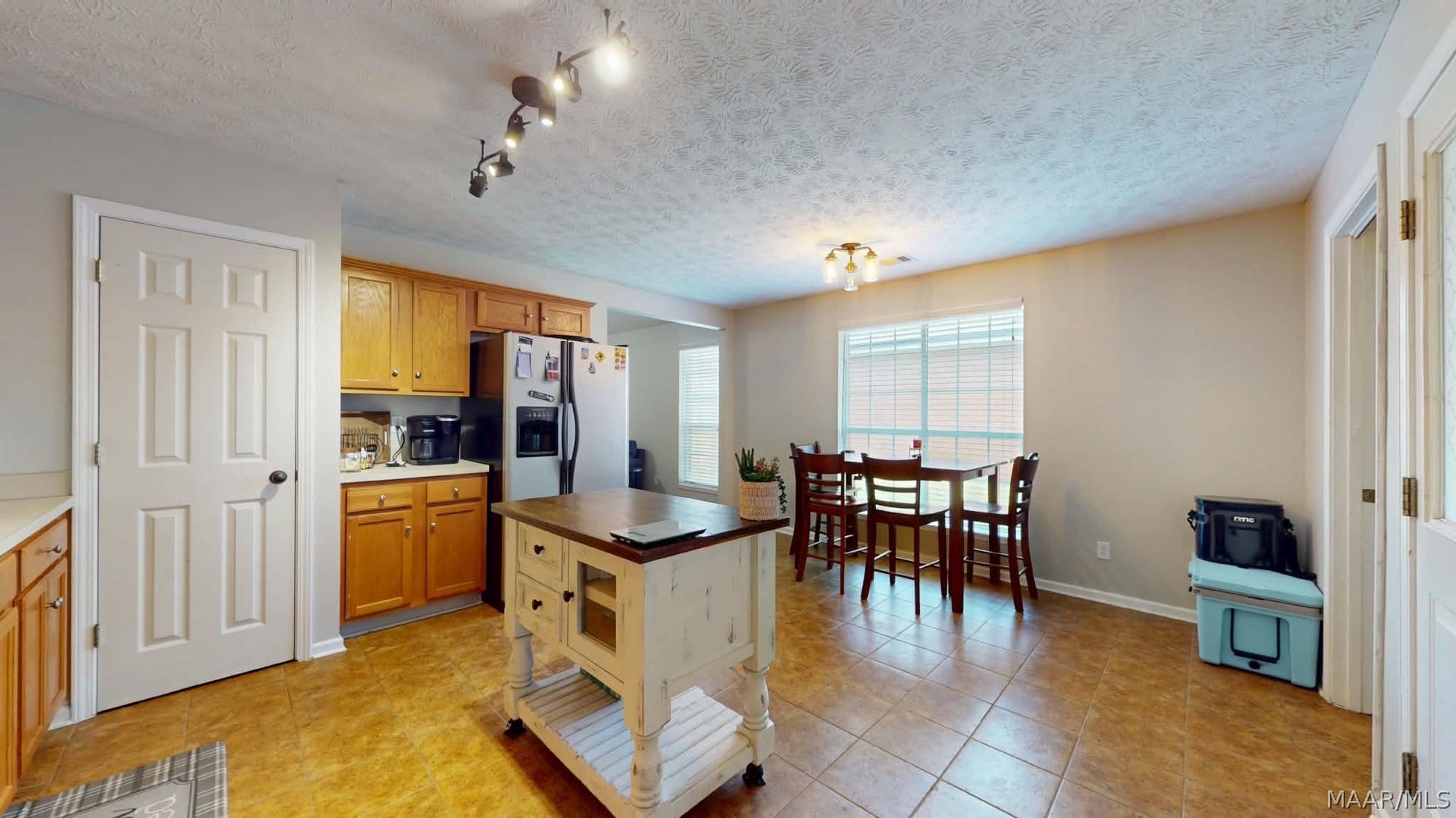 250 Mill Ridge Drive, Millbrook, AL 36054 Pantry, smooth top range, and wood cabinets