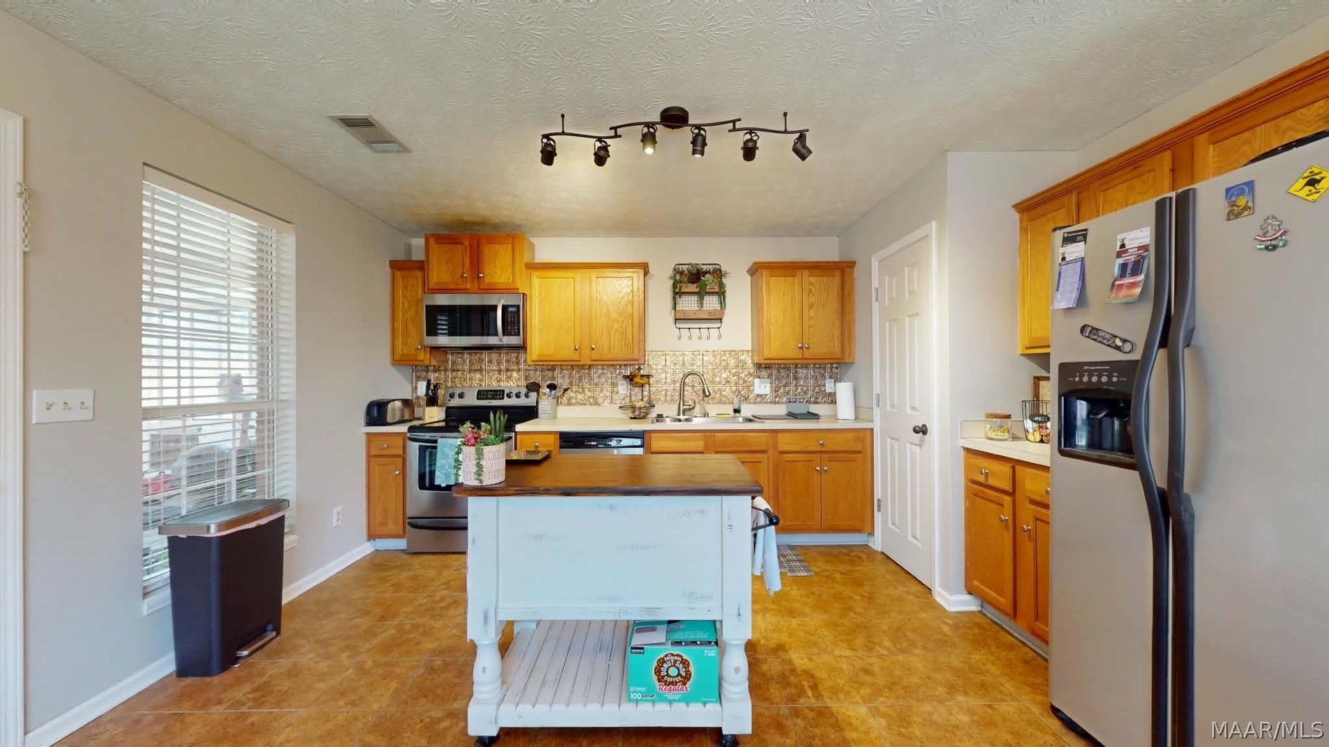 250 Mill Ridge Drive, Millbrook, AL 36054 Plenty of room for an island piece of furniture and a dining table
