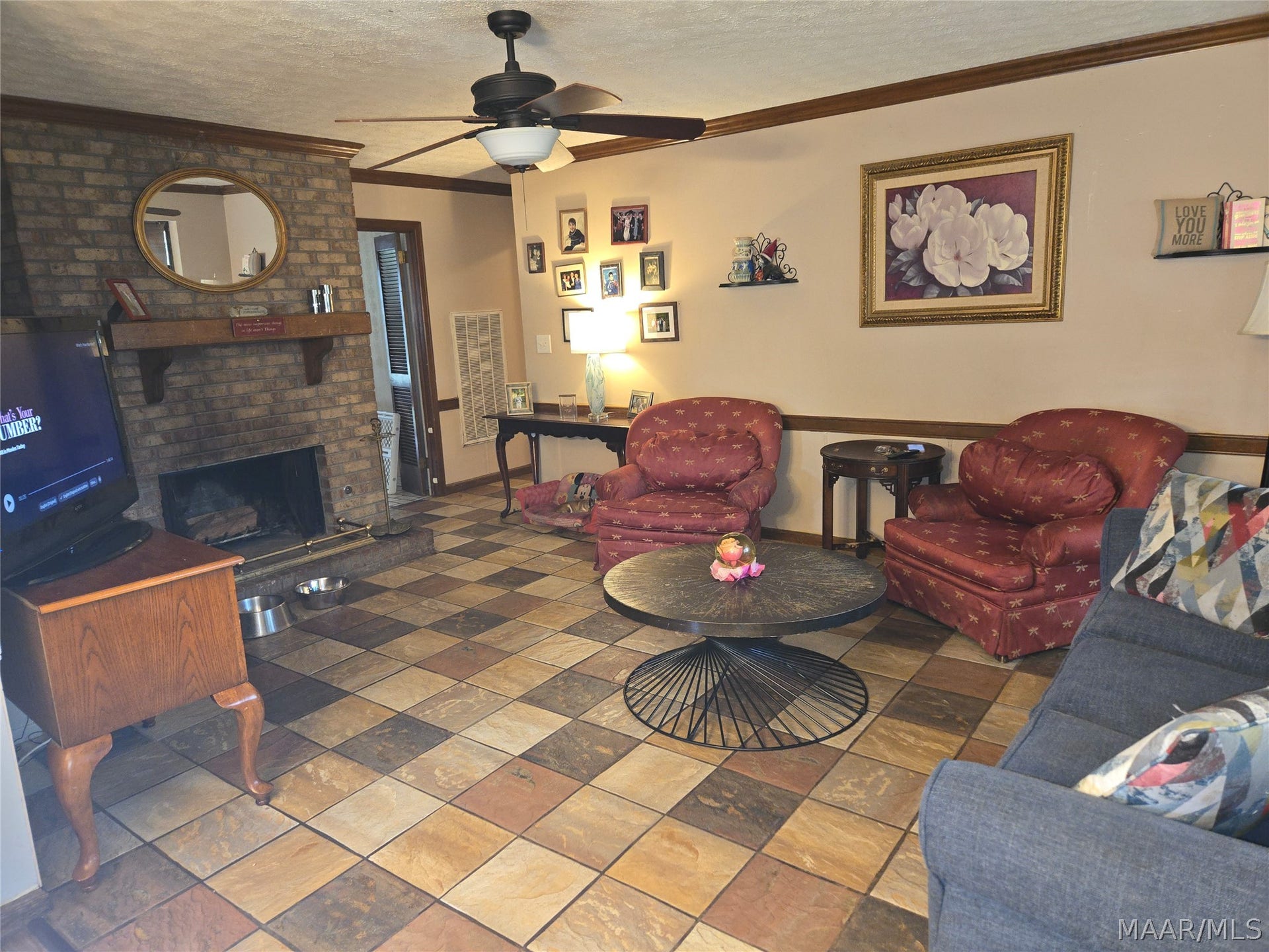 Cozy Family room with fireplace...look at that tile floor!!