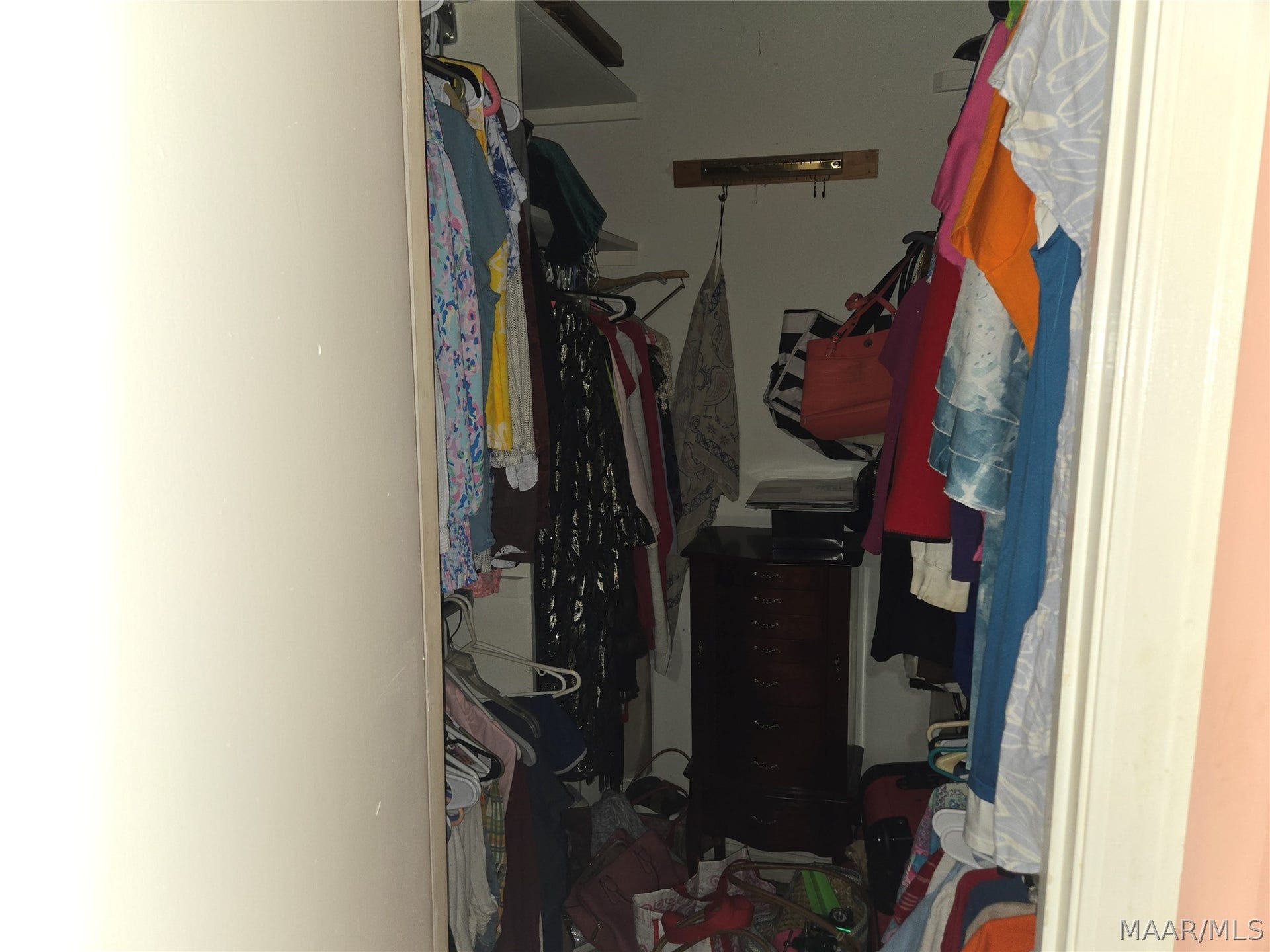 Walk in closet primary bedroom