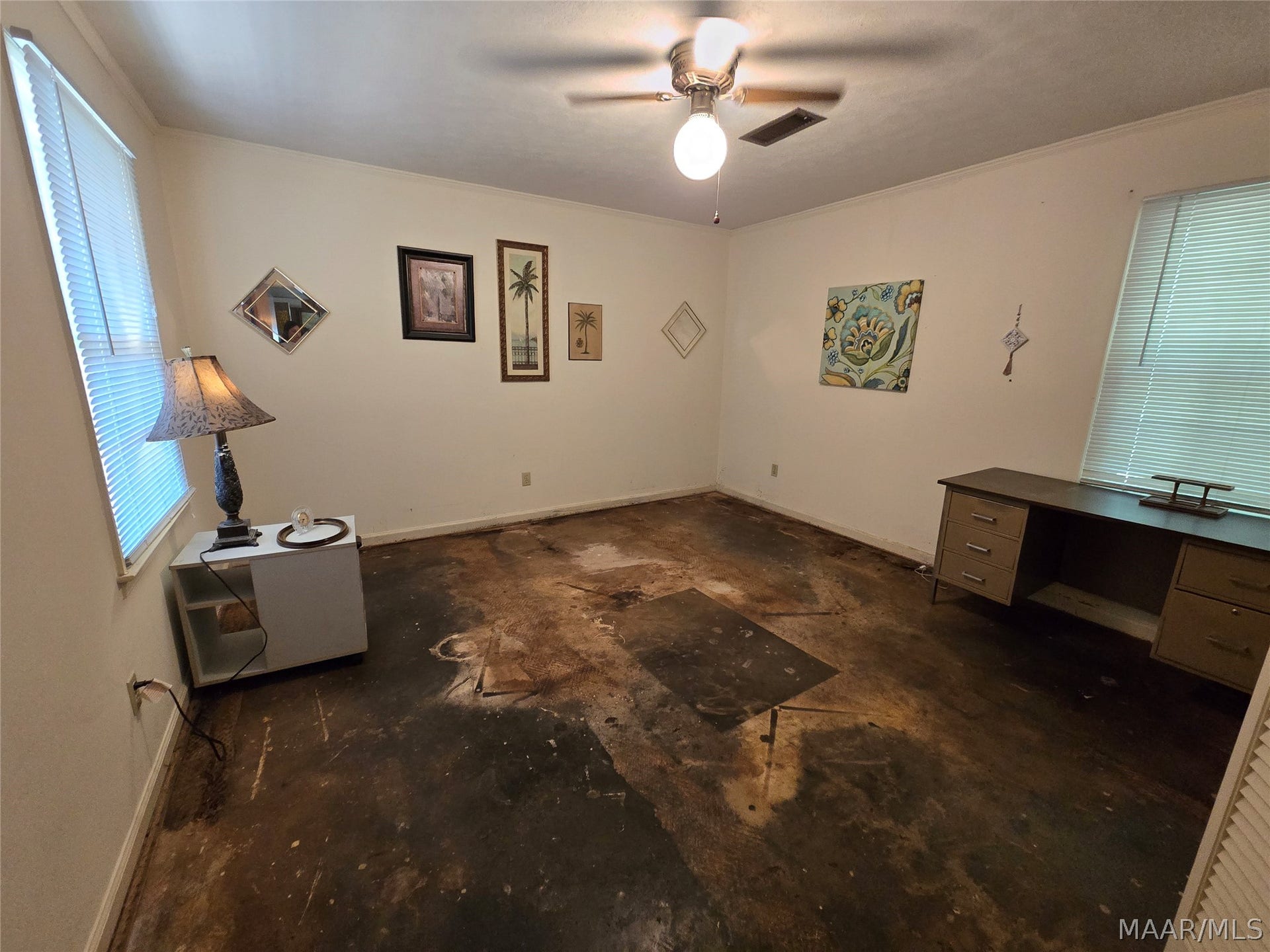 Master bedroom has stained concrete floors
