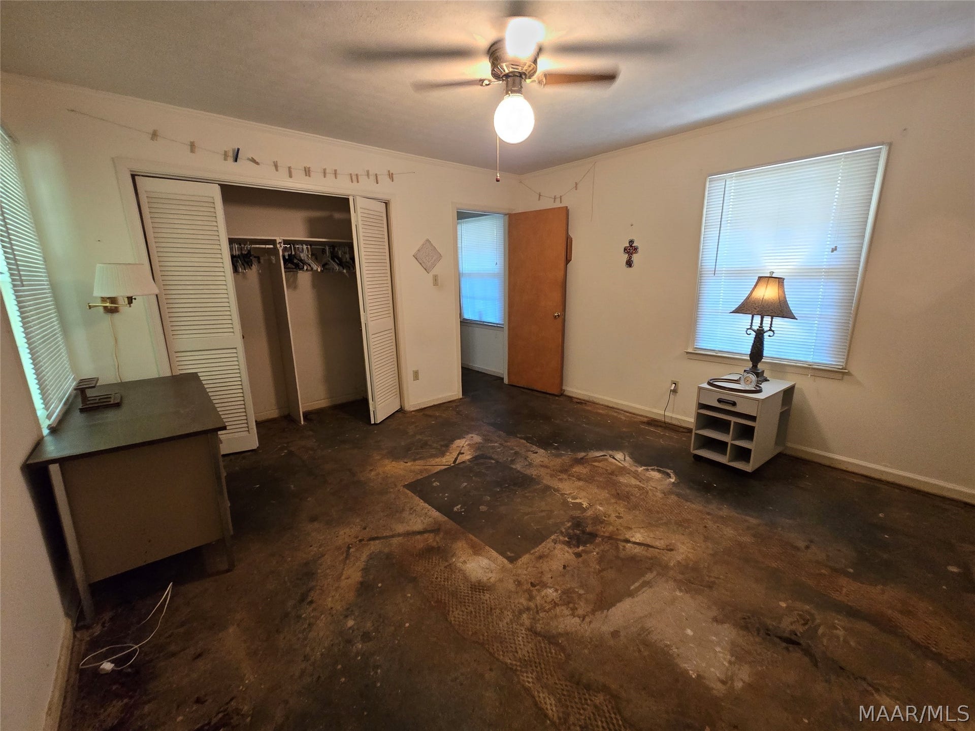 Master bedroom has stained concrete floors