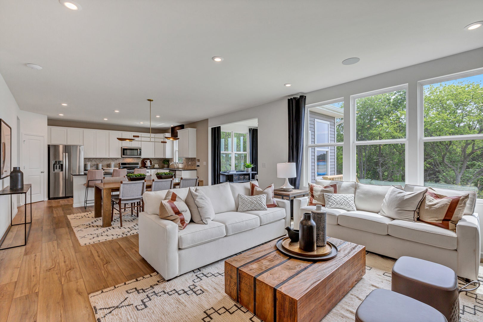 SPACIOUS GATHERING ROOM OPEN TO KITCHEN AND EATING