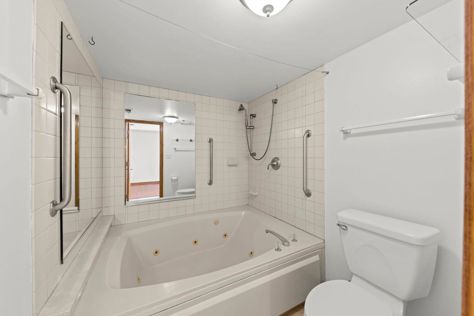 Primary bathtub with shower hose.