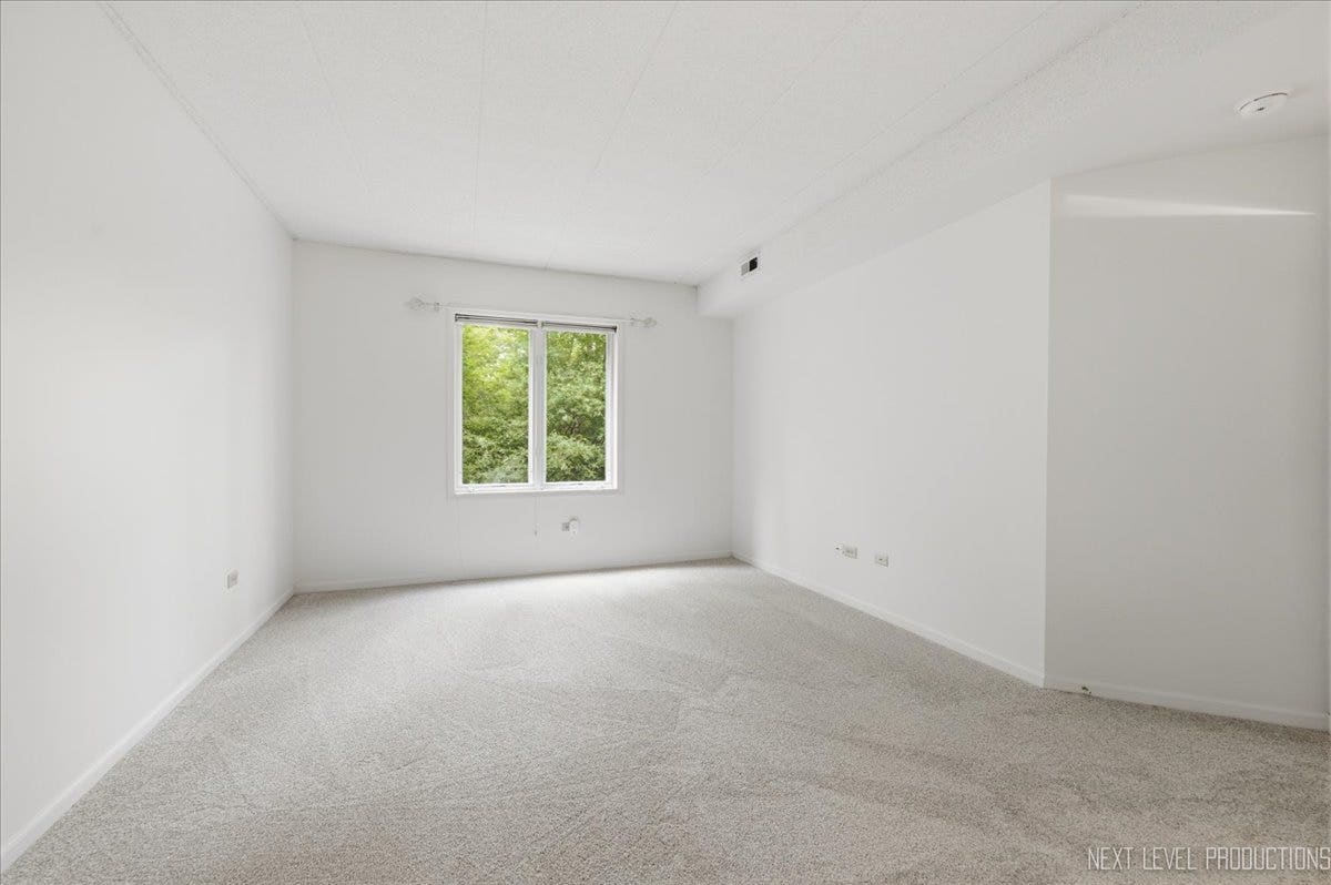 7841 W 157th Street, #104, Orland Park, IL 60462 The primary bedroom has beautiful windows allowing