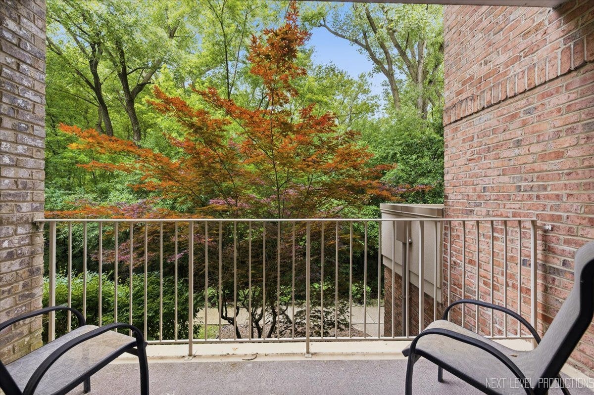 7841 W 157th Street, #104, Orland Park, IL 60462 Sliding glass doors provide direct access to the p