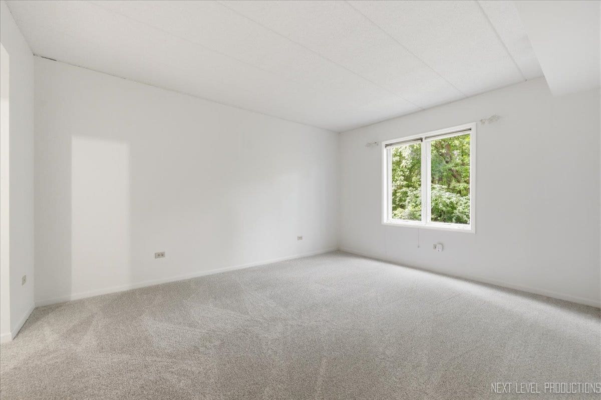 7841 W 157th Street, #104, Orland Park, IL 60462 Large primary bedroom with an en-suite bath and a