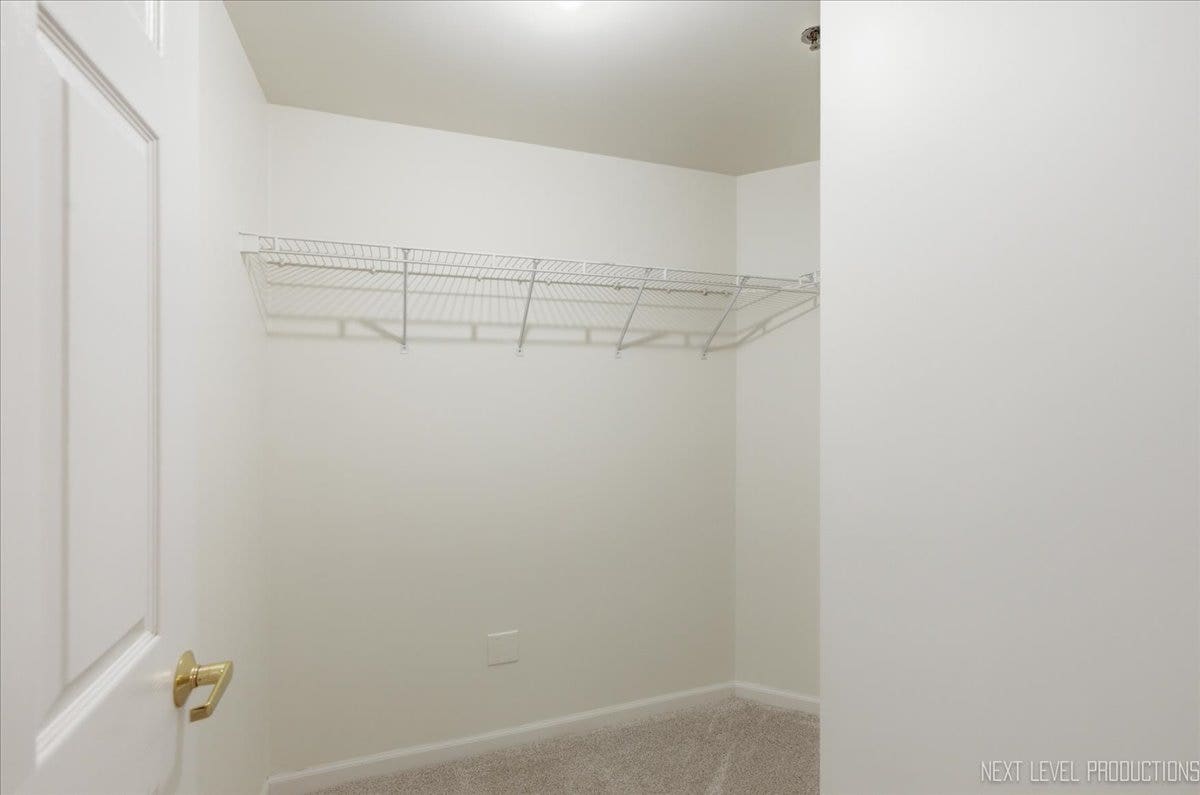 7841 W 157th Street, #104, Orland Park, IL 60462 Primary bedroom walk-in closet.