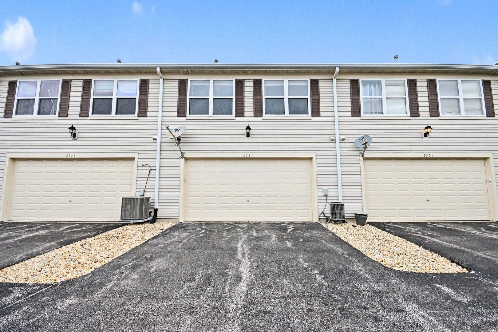 Oversized two-car garage with additional driveway