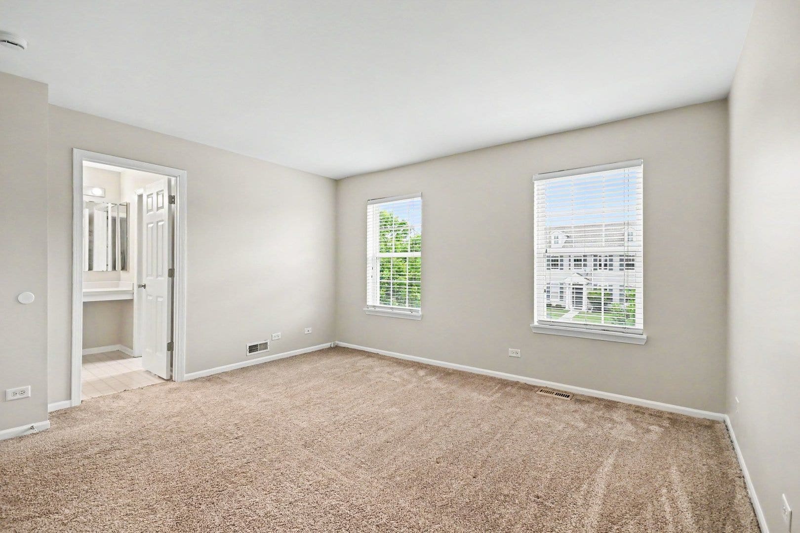 Spacious primary suite featuring an en-suite bathr