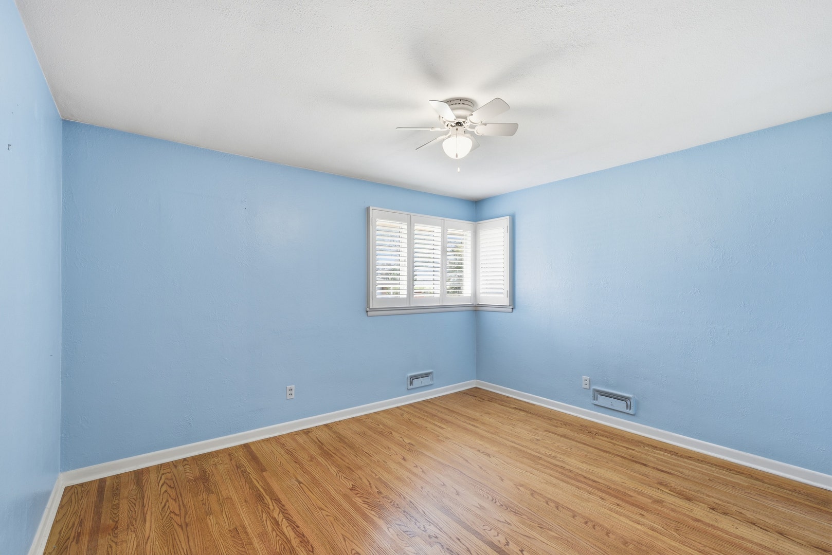 A master bedroom with plantation shutters