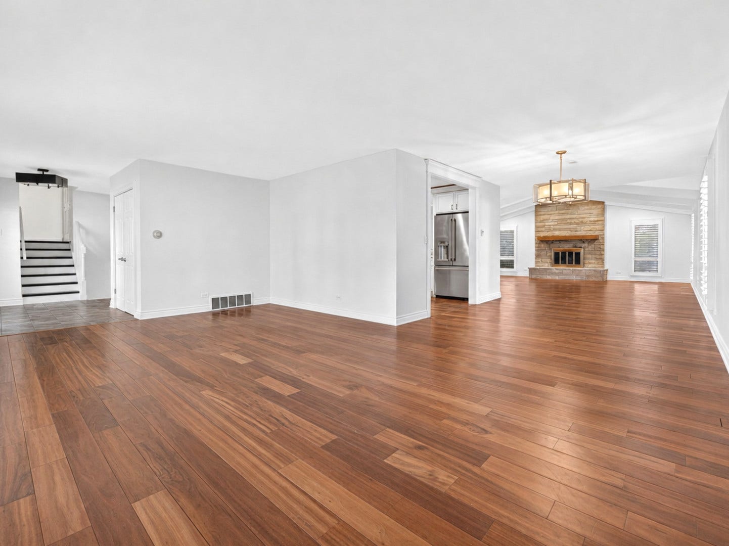 800 RIDGEMOOR Drive W, Willowbrook, IL 60527 Living room, dining room and family room view.