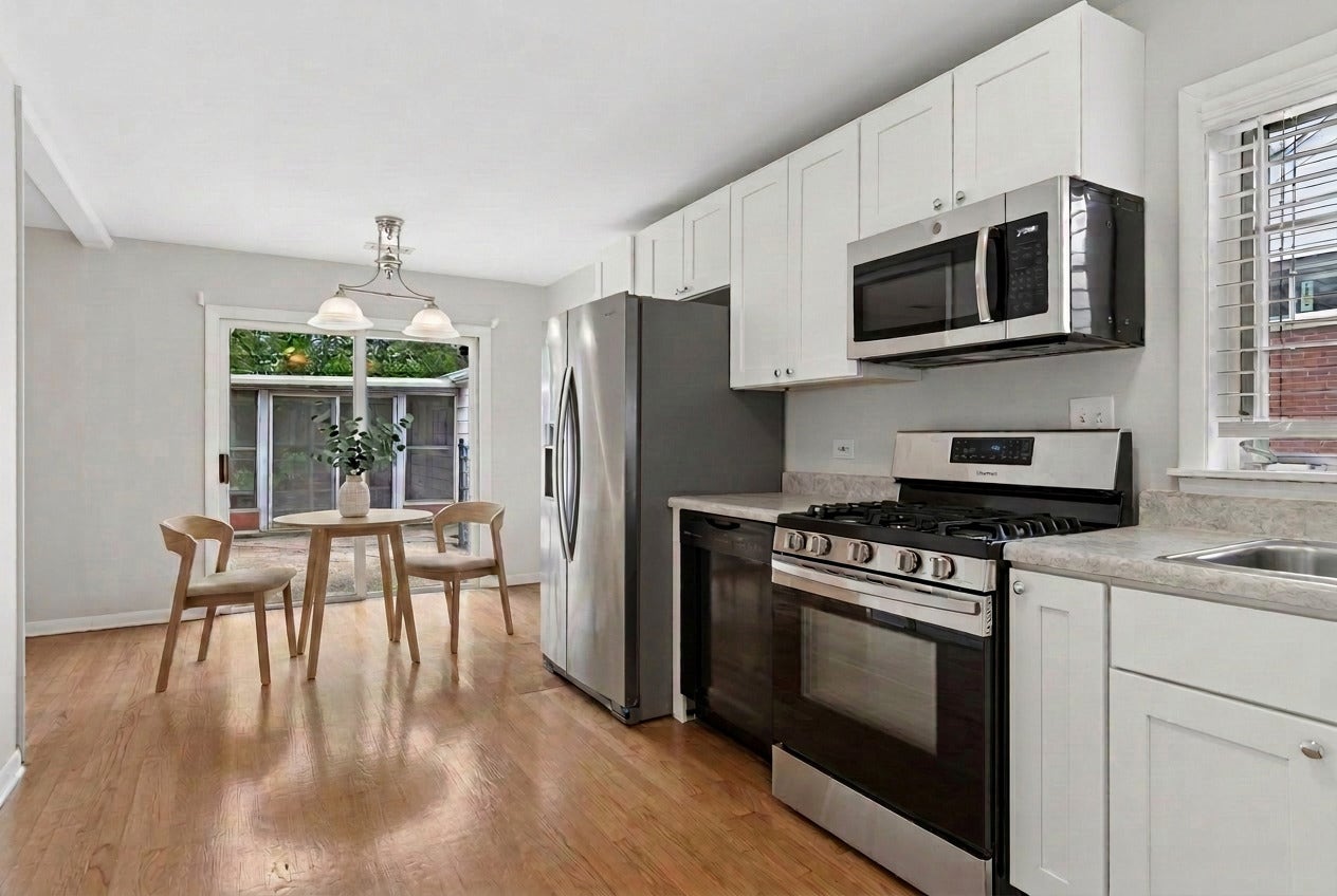 Updated kitchen with table space and access to bac