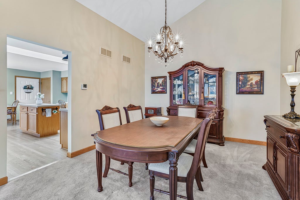FORMAL DINING ROOM W/VAULTED CEILINGS AND PLENTY O