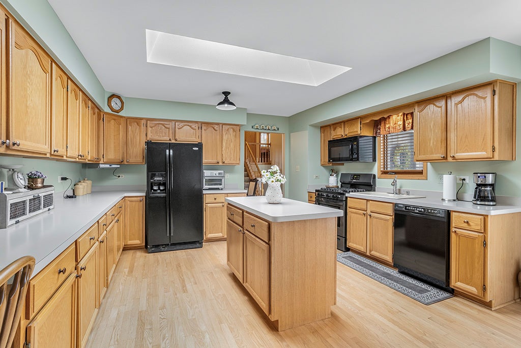 LOTS OF CABINETS & COUNTERTOPS & AN ISLAND, TOO!