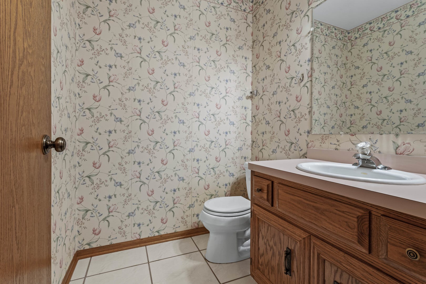 This half bathroom is located on the main level ce