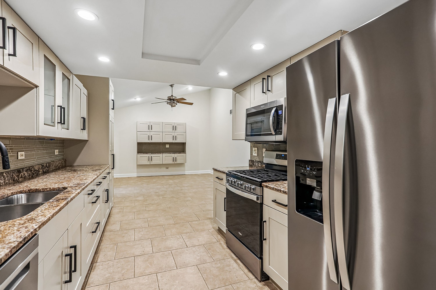 The kitchen flows seamlessly into the family room