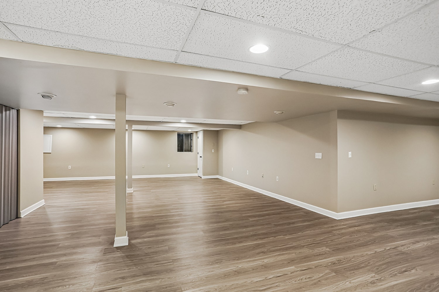 Durable wood-laminate flooring runs throughout the