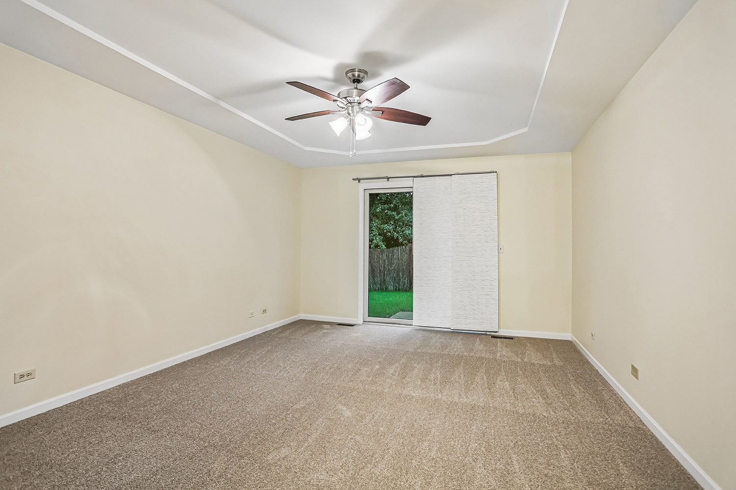 Master bedroom has sliding glass doors that lead o