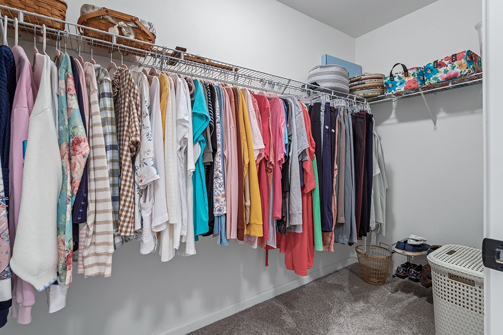 This walk in closet is located in the primary suit