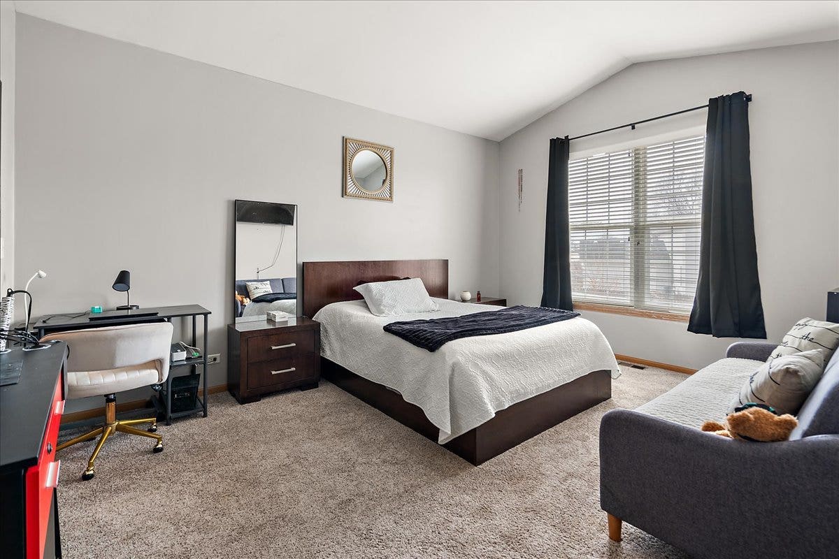2941 Woodside Drive, Joliet, IL 60431 The spacious primary suite has high ceilings.