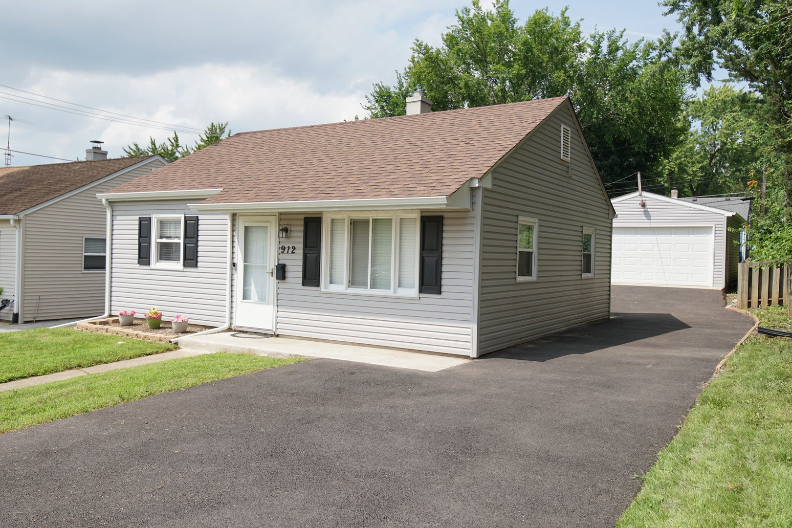 New driveway with additional parking in front.