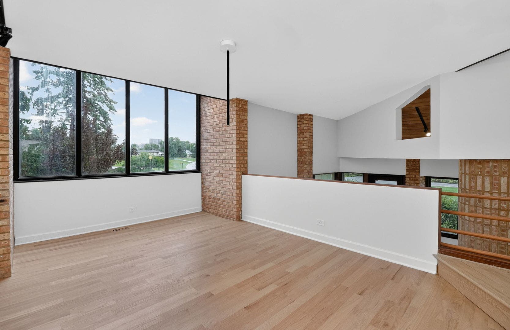 42 Royal Vale Drive, Oak Brook, IL 60523 Perched above the street on a hill, each window pr
