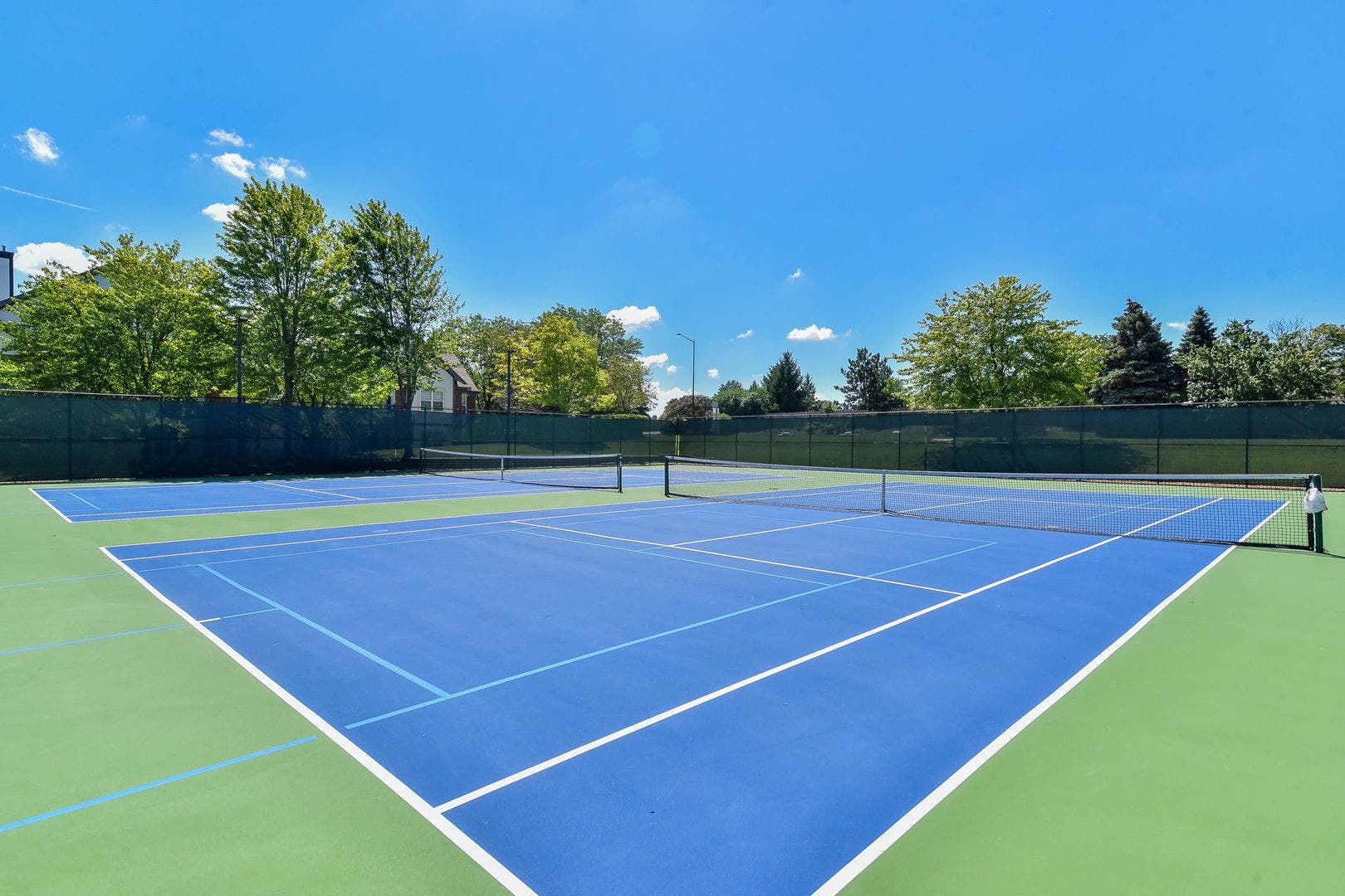417 Saratoga Drive, Aurora, IL 60502 Refinished tennis courts which include lines for p
