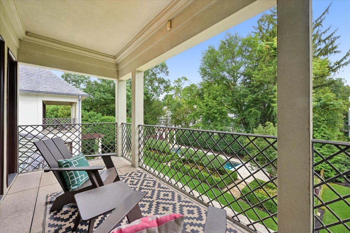 The Primary Suite features this outdoor balcony th