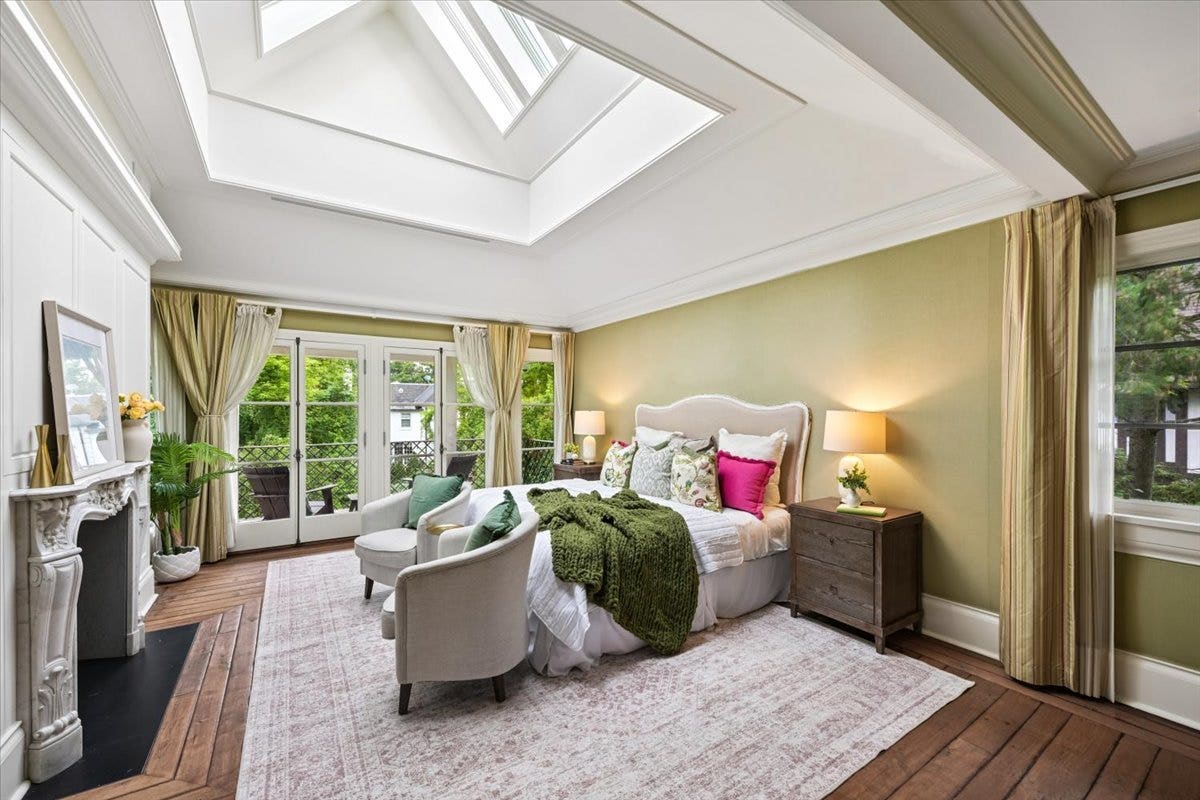 The Primary Suite features a Marble Fireplace impo