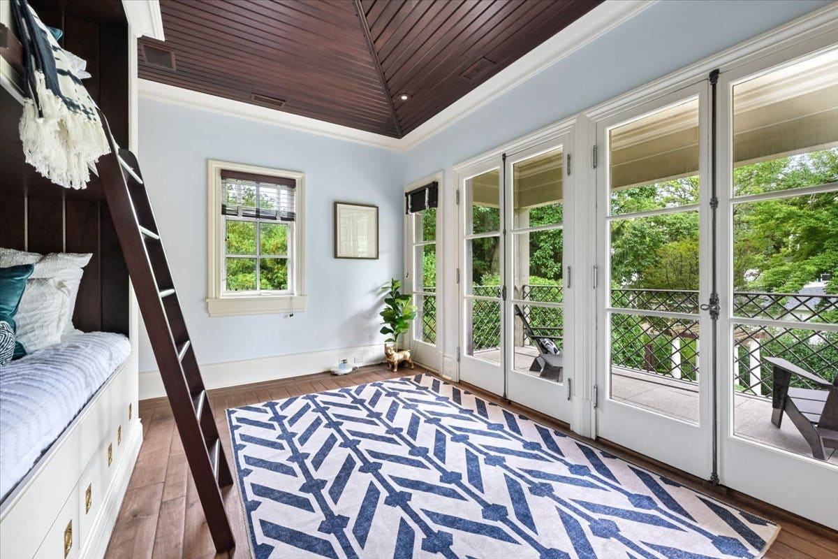 This bedroom boasts a built in bunk beds, a fabulo