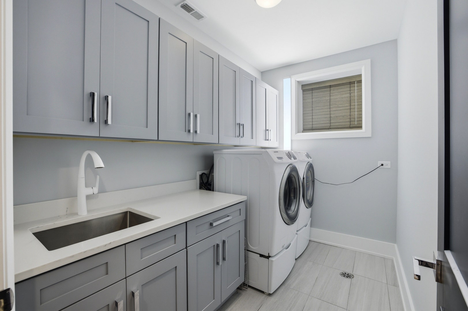 Lower level laundry room; additional laundry close