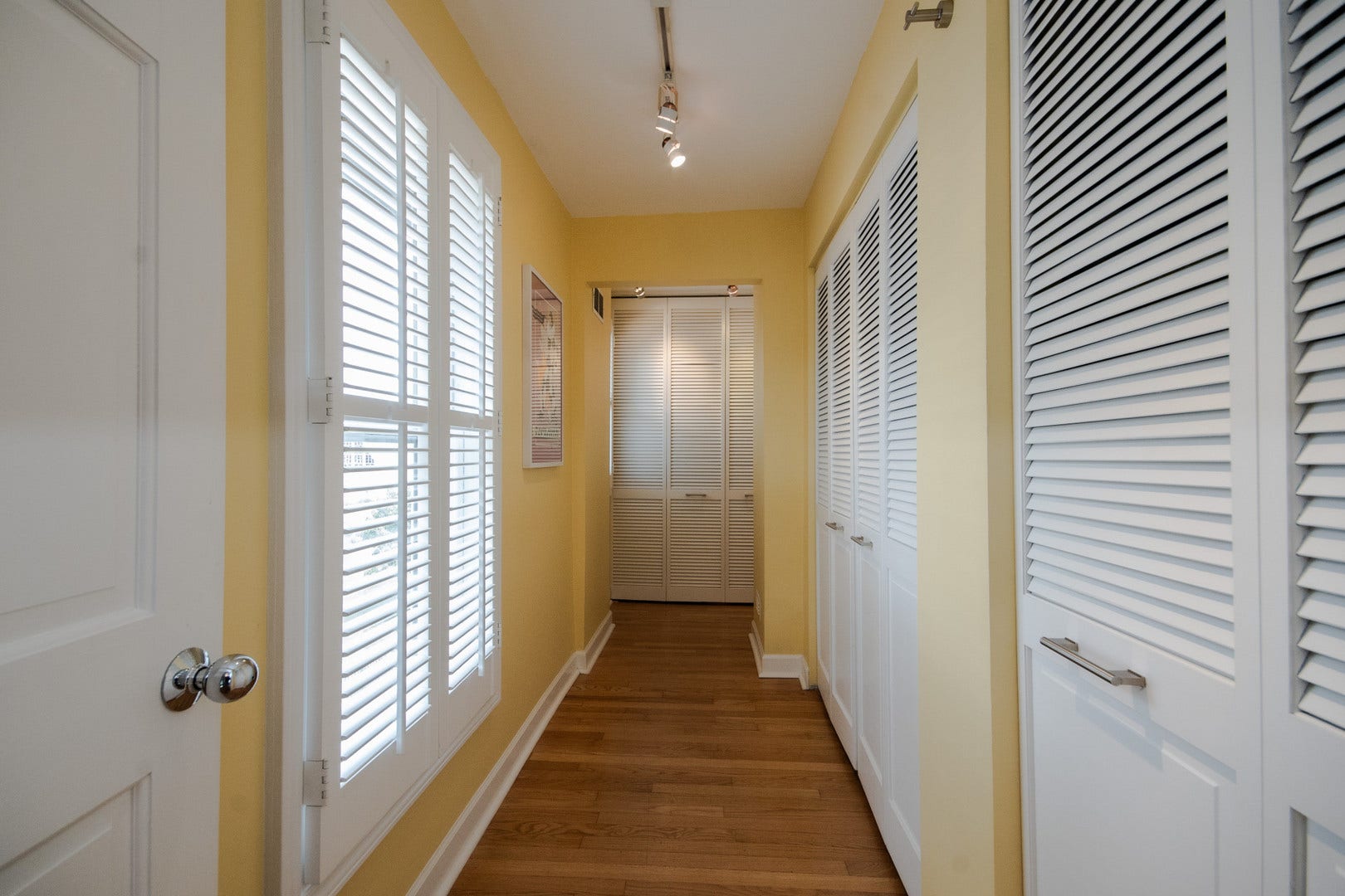 Primary Hall lined with closet space.