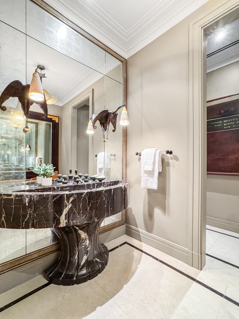 1524 N Astor Street, Chicago, IL 60610 The powder room includes a hand-carved marble sink
