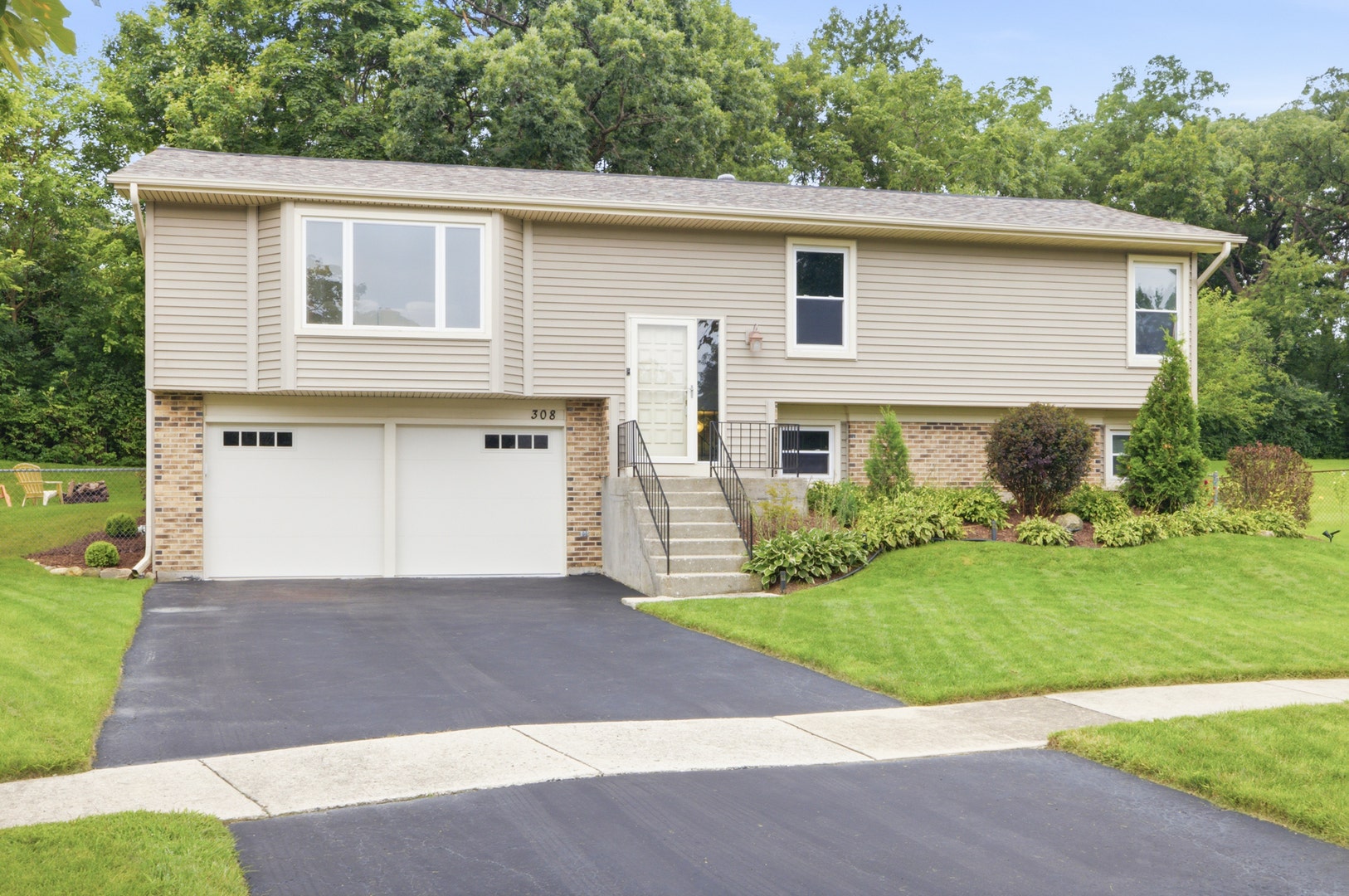Beautifully landscaped and lots of significant upd